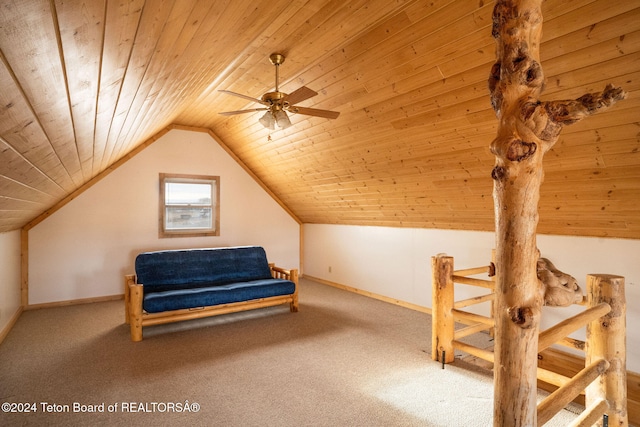 interior space featuring carpet, lofted ceiling, and wood ceiling