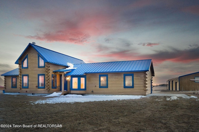6 Black Bear Rd, Pinedale, WY 82941 - view of front of property with log siding, a metal roof, and a standing seam roof