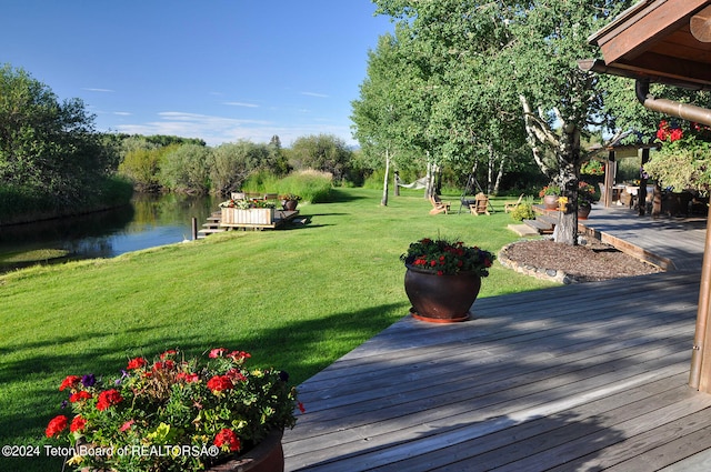 exterior space featuring a water view and a yard