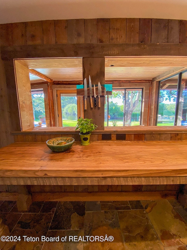 bathroom with wood walls