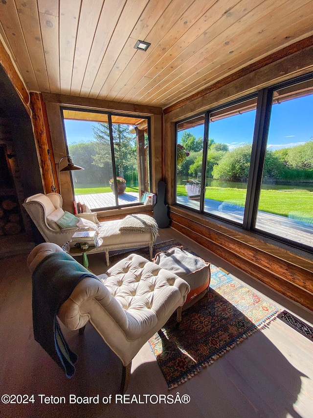 living room featuring wood-type flooring and wood ceiling