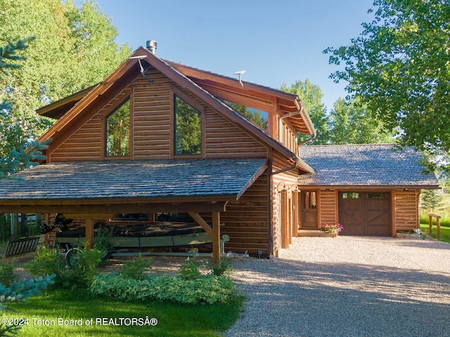 log cabin with a garage