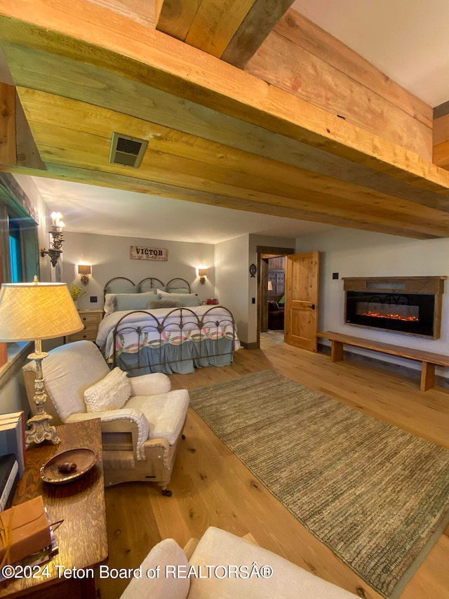 bedroom featuring wood ceiling and light wood-type flooring