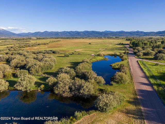 birds eye view of property with a rural view and a water and mountain view