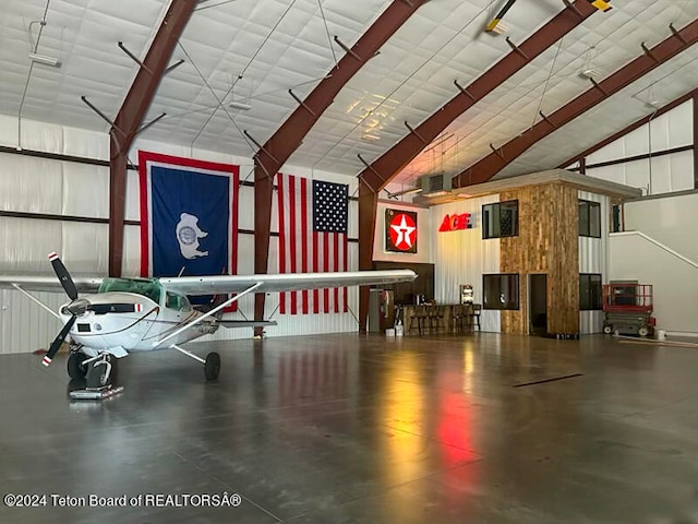 interior space with lofted ceiling and concrete floors