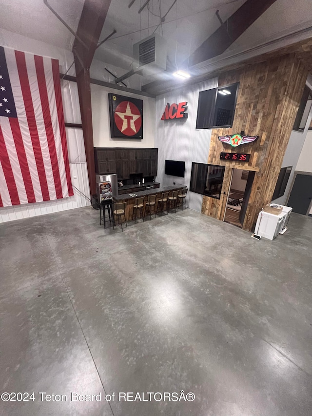 garage featuring wooden walls