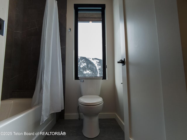 bathroom featuring tile patterned flooring, a wealth of natural light, toilet, and shower / bathtub combination with curtain