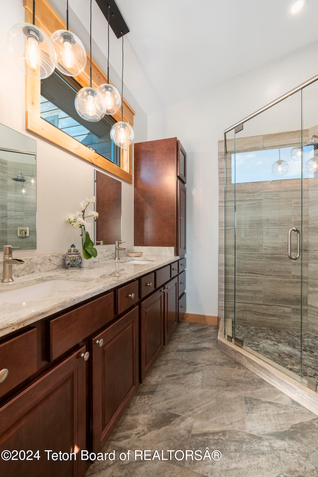 bathroom featuring walk in shower and vanity