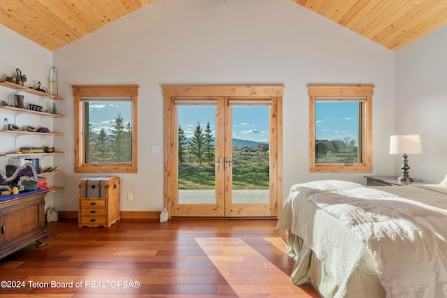 bedroom with wood-type flooring, access to exterior, high vaulted ceiling, and wooden ceiling