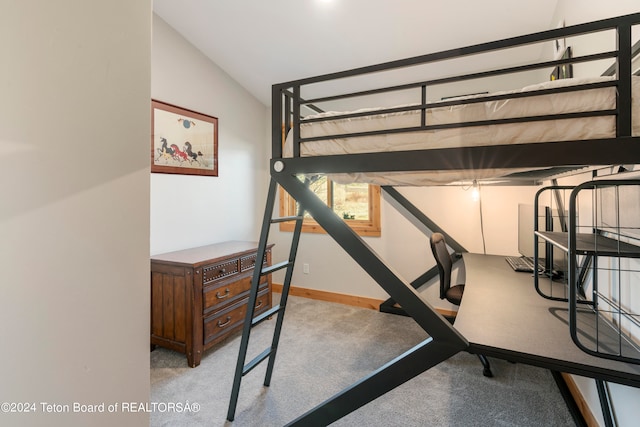 bedroom featuring lofted ceiling and light colored carpet