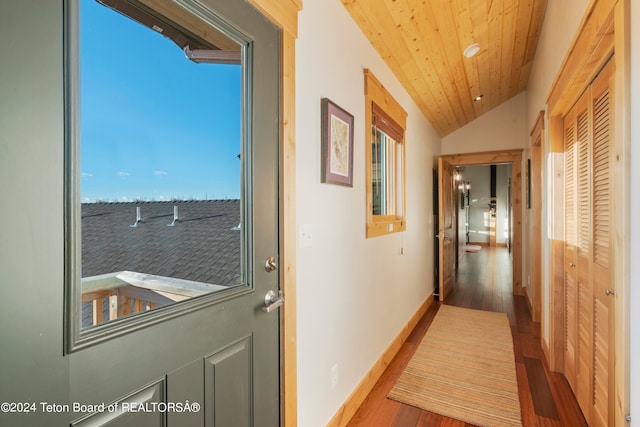 hallway with wood ceiling, vaulted ceiling, and hardwood / wood-style floors