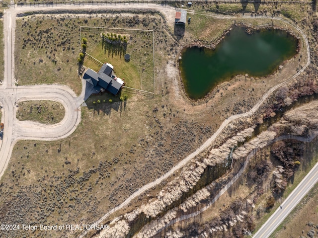 aerial view with a water view and a rural view