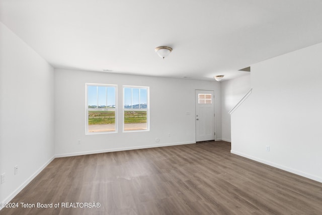 spare room with hardwood / wood-style floors