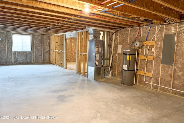 basement featuring heating unit, electric panel, and secured water heater