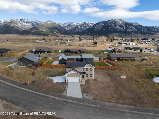 birds eye view of property featuring a mountain view