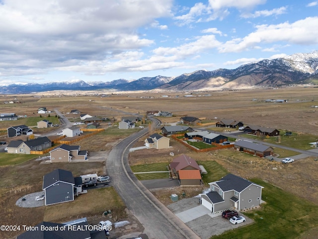 birds eye view of property featuring a mountain view