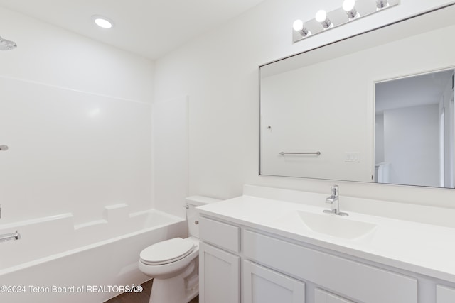 full bathroom with shower / bath combination, vanity, and toilet