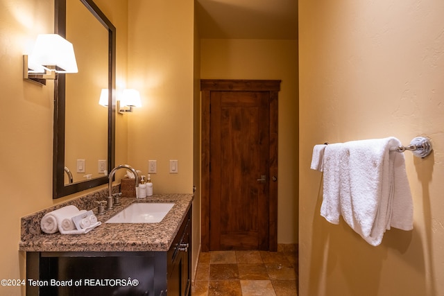 bathroom featuring tile patterned floors and vanity