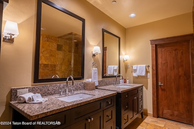 bathroom featuring tile patterned floors and dual bowl vanity