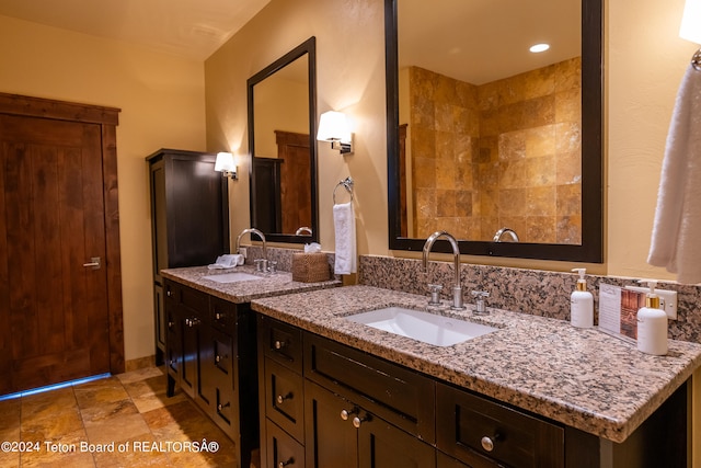 bathroom featuring double vanity and tile patterned flooring