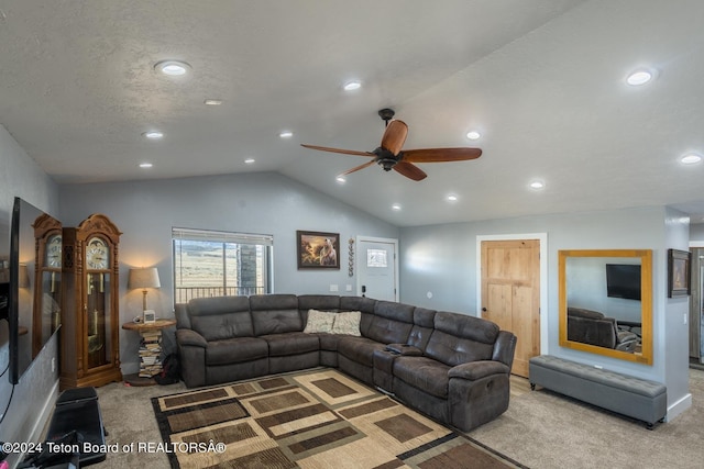 carpeted living room with lofted ceiling, ceiling fan, and a textured ceiling