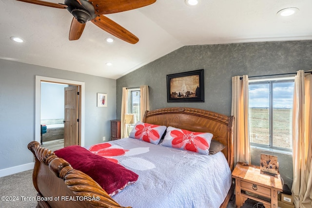 carpeted bedroom with lofted ceiling, ceiling fan, and ensuite bathroom