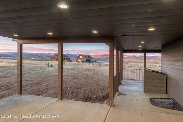 patio terrace at dusk with a mountain view