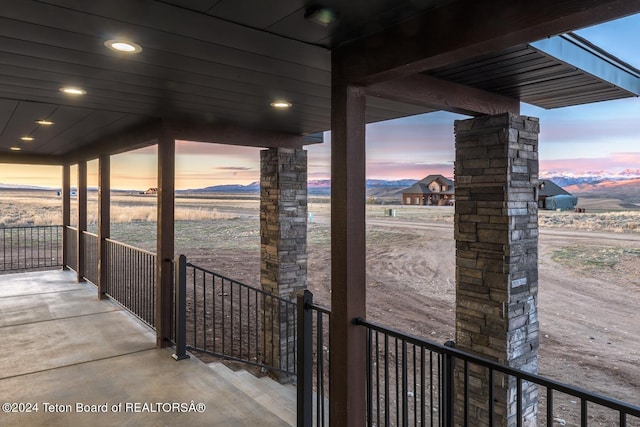 patio terrace at dusk with a mountain view