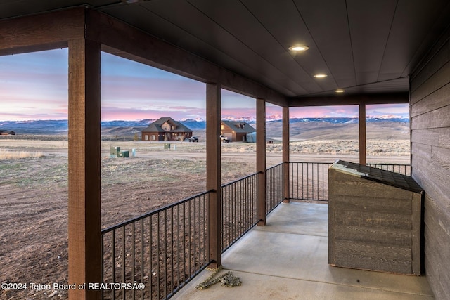 balcony at dusk with a mountain view