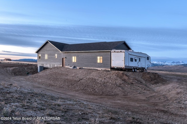 exterior space featuring a mountain view and central AC