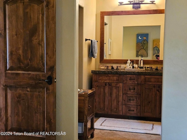 bathroom with vanity and tile patterned flooring