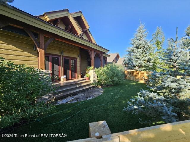 view of yard featuring french doors