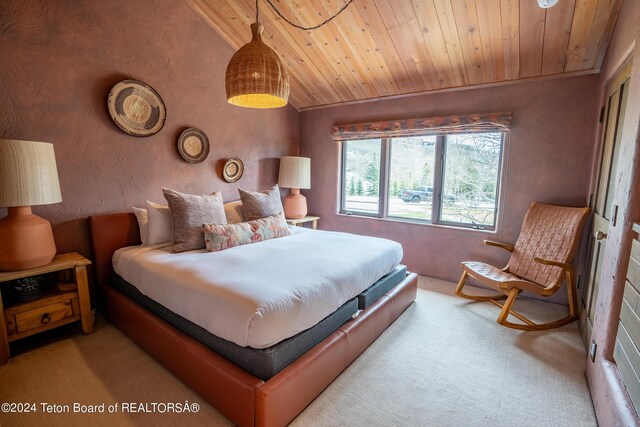 bedroom featuring wooden ceiling, vaulted ceiling, and carpet