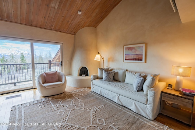 living room with lofted ceiling, hardwood / wood-style flooring, and wood ceiling