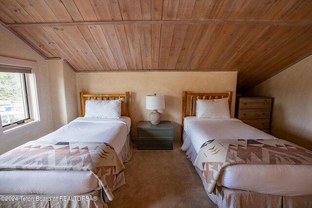 bedroom featuring lofted ceiling, carpet flooring, and wooden ceiling