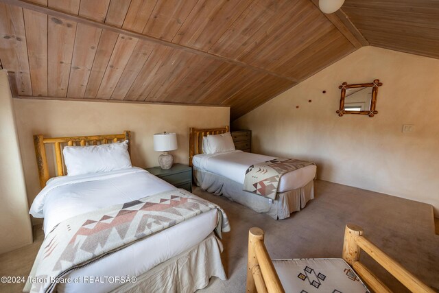 bedroom with wood ceiling, vaulted ceiling, and carpet