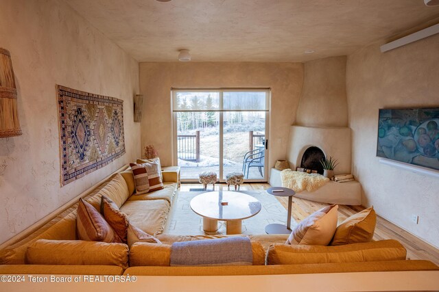 living room featuring a fireplace and hardwood / wood-style flooring