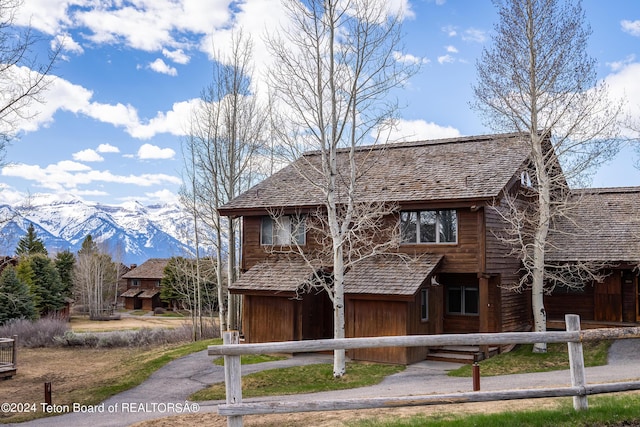 view of front of home with a mountain view