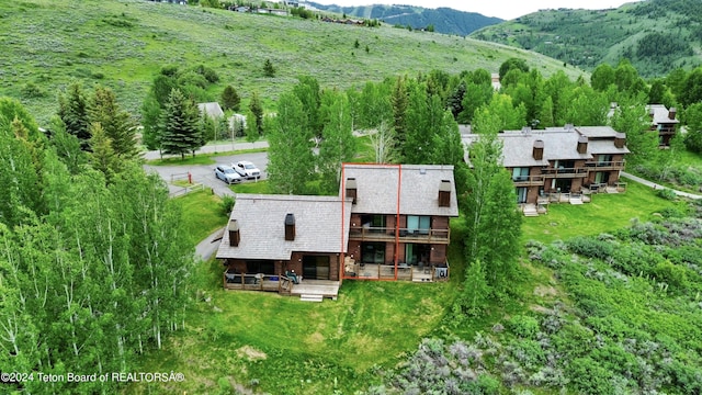 birds eye view of property featuring a mountain view