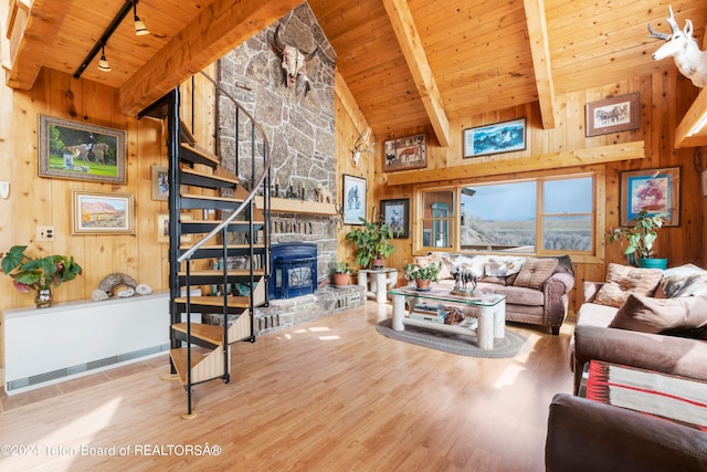 581 E Fork Rd, Dubois, WY 82513 - living area featuring wooden walls, a wooden ceiling with exposed beams, stairs, wood finished floors, and rail lighting