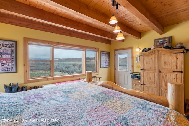 581 E Fork Rd, Dubois, WY 82513 - bedroom with a wood ceiling with exposed beams