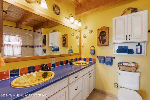 581 E Fork Rd, Dubois, WY 82513 - bathroom with a wooden ceiling with exposed beams, double vanity, tile patterned floors, and a shower