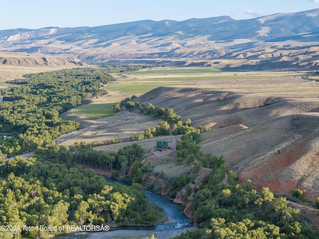 581 E Fork Rd, Dubois, WY 82513 - aerial view of property and surrounding area featuring a mountainous background