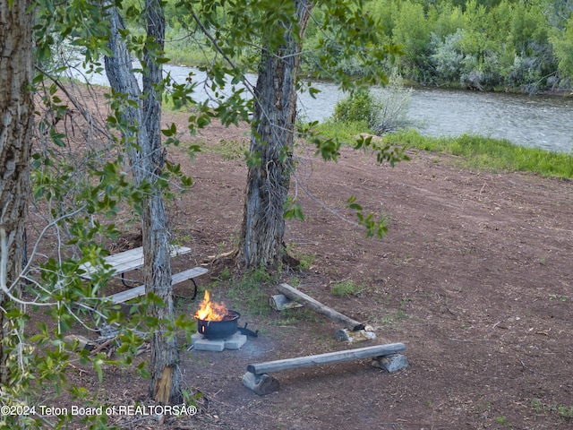 581 E Fork Rd, Dubois, WY 82513 - view of yard with a fire pit and a water view