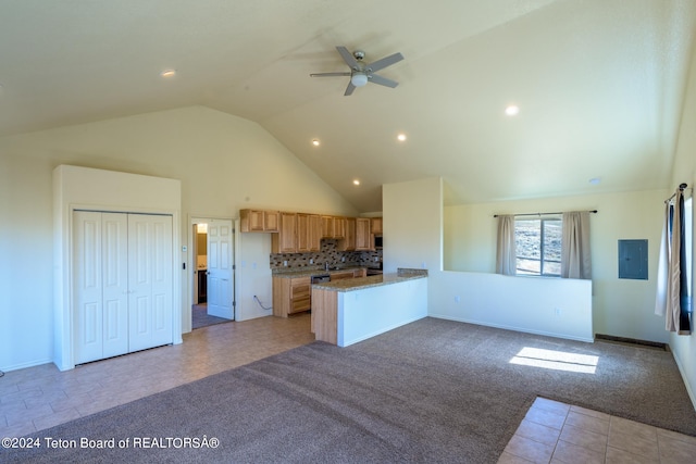 kitchen with backsplash, kitchen peninsula, ceiling fan, and light tile floors