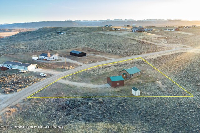 bird's eye view with a mountain view and a rural view