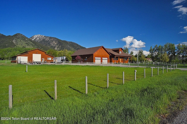 view of yard featuring a mountain view and a rural view