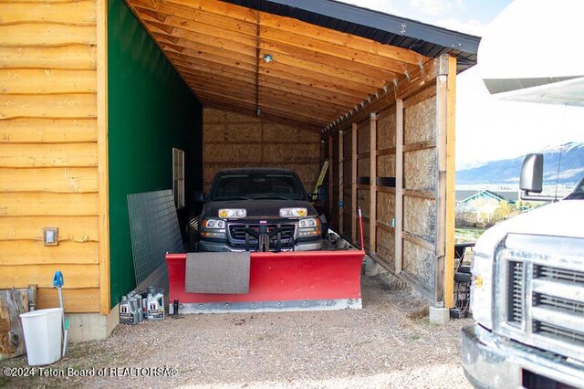 exterior space featuring a mountain view and a carport