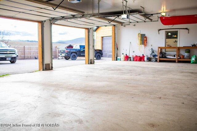 garage featuring a mountain view and a garage door opener