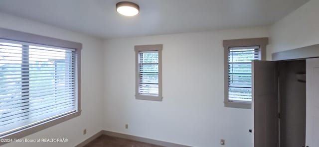 unfurnished bedroom with a closet and carpet